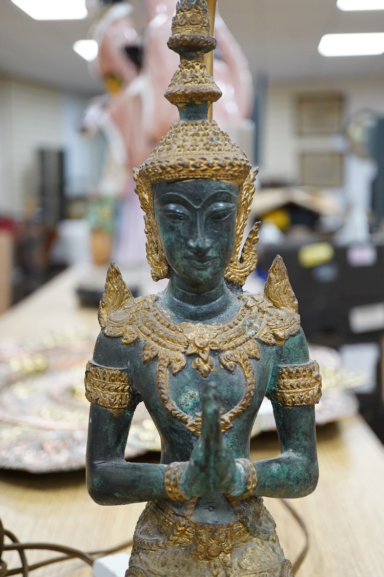 A Chinese blue and white ‘shuangxi’ vase and cover, mounted as a lamp, together with a lamp mounted with a bronze Thai figure, largest 50cm high including light fitting